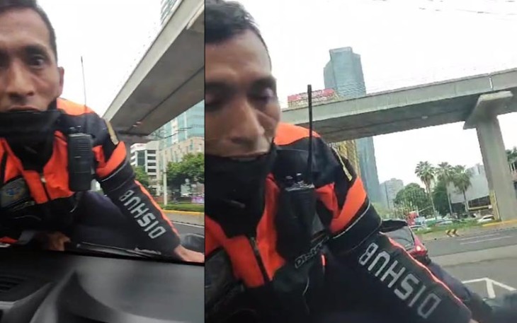 Petugas Dishub saat Nemplok Terbawa di Kap Mobil 