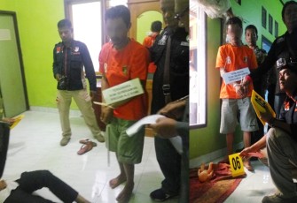 Tersangka saat melakukan adegan rekonstruksi di TKP