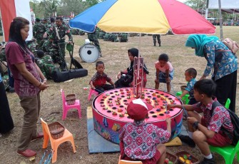 Pembukaan TMMD Cilacap Membawa Berkah Wahana Permainan Memancing Kodok