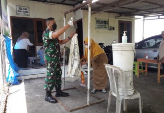 Babinsa saat beri pendampingan posyandu