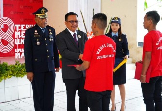 Wali Kota Bitung saat membacakan sambutan Menteri Hukum dan HAM RI