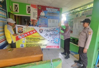 Polres BS Serahkan Spanduk Imbauan Kepada Kades Batu Lambang