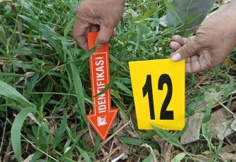 Polisi saat identifikasi di TKP