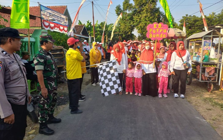 Anggota Koramil Madiun saat Amankan Lomba Gerak Jalan Memperingati HUT Kemerdekaan RI.