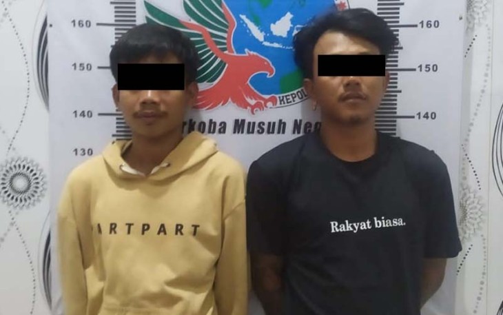Dua tersangka saat diamankan