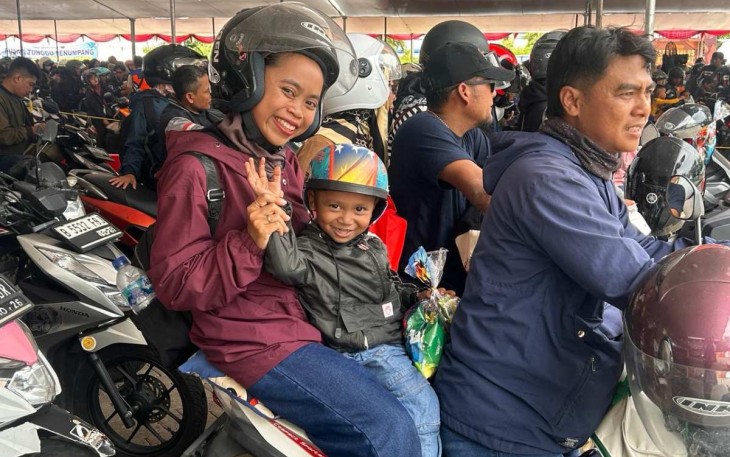 Ilustrasi pemudik nataru menggunakan moda sepeda motor 