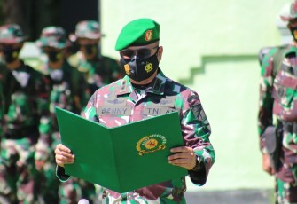 Dandim 1310/Bitung Letkol INF Benny Lesmana SE MHan saat membacakan Laporannya