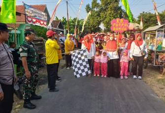 Anggota Koramil Madiun saat Amankan Lomba Gerak Jalan Memperingati HUT Kemerdekaan RI.