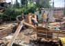 Bantu membongkar rumah warga desa binaan 