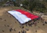 Merah Putih Raksasa Berkibar di Perbatasan, Yonarmed 12 Kostrad Kobarkan Semangat Kemerdekaan